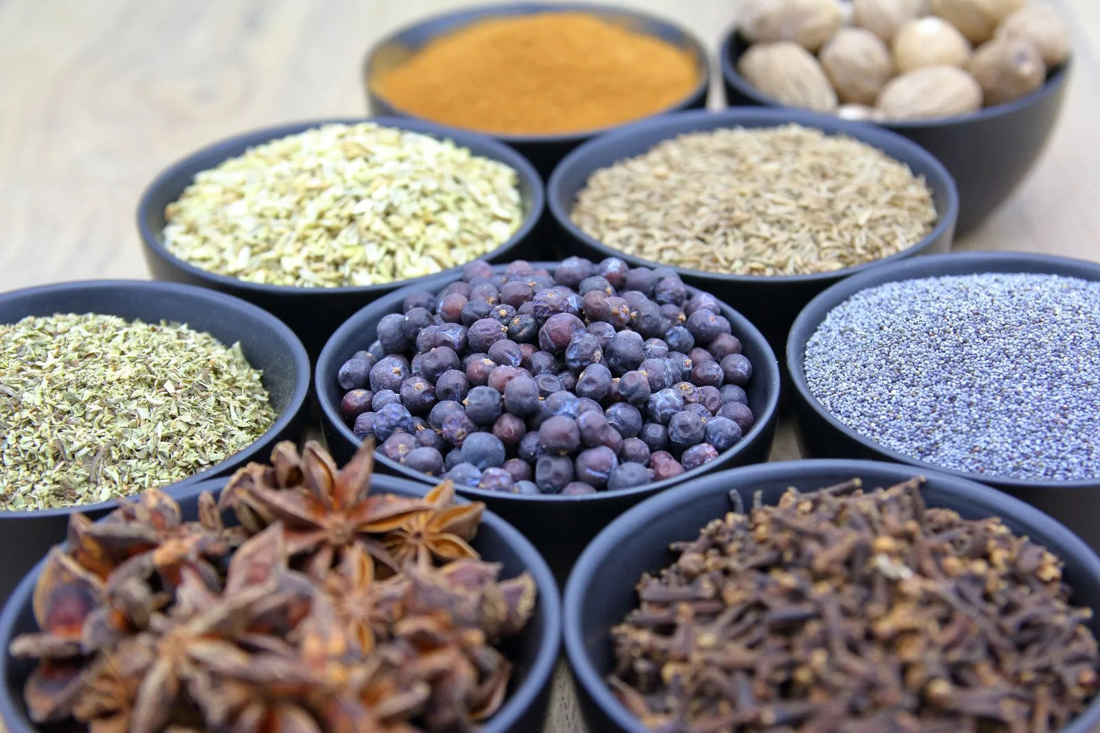Whole spices and seeds in small bowls