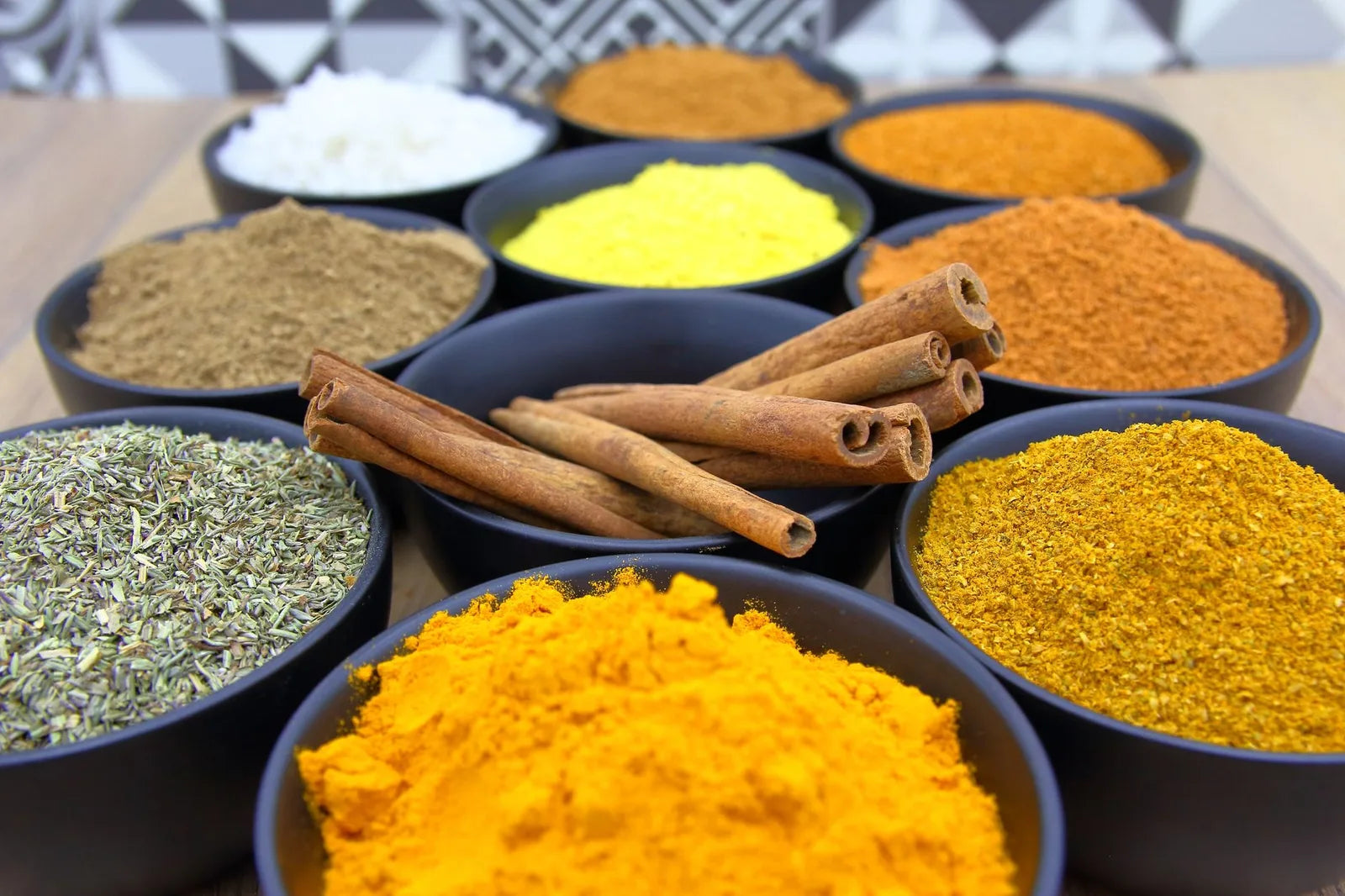 Assorted spices and herbs in small bowls